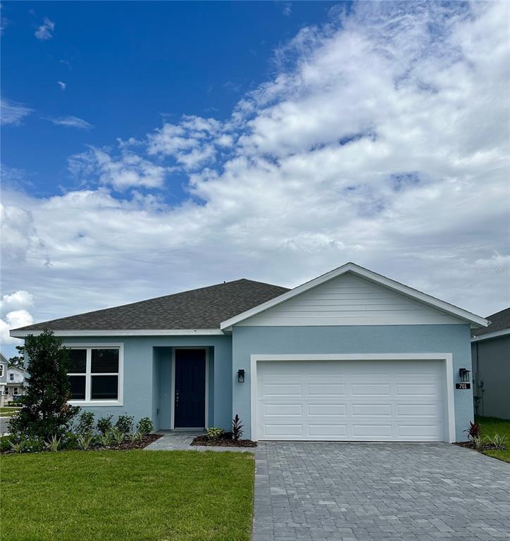 701 Farfields Street DeLand, FL 32724 - Photo 1 of 1 a front view of house with yard and green space