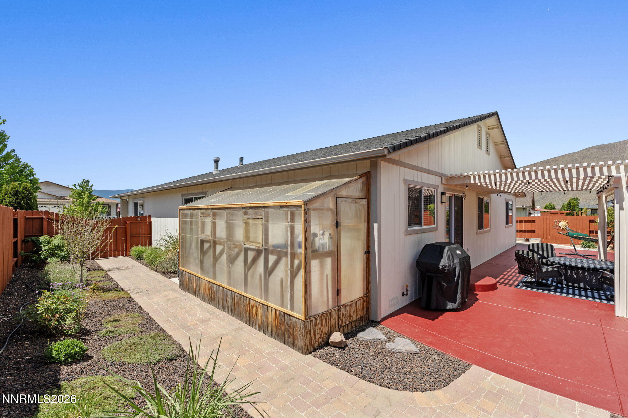 18324 Panda Bear Court Reno, NV 89508 - Photo 25 of 44 a view of a house with wooden floor roof deck