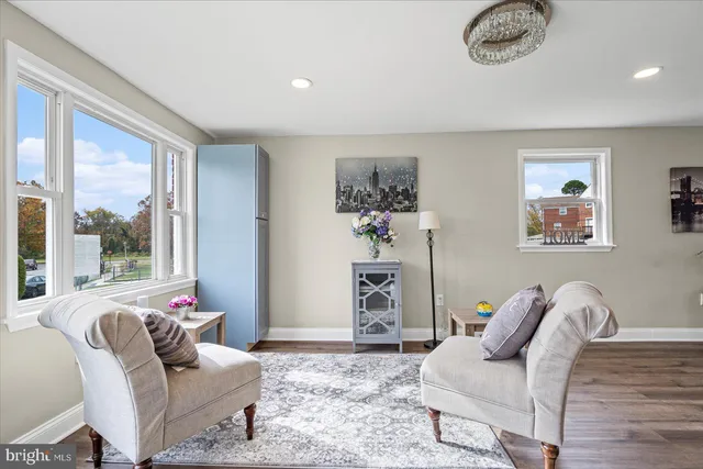 a living room with furniture or couch and a large window