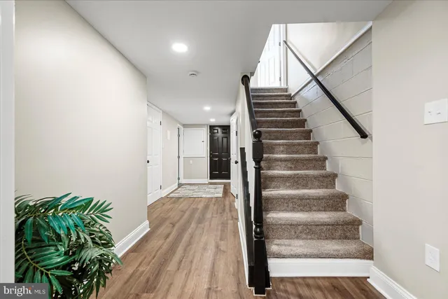 a view of entryway with wooden floor