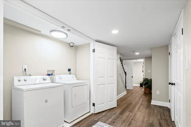 a view of a hallway with washer and dryer