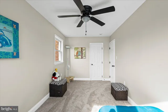 a living room with hard wood flooring and a couch