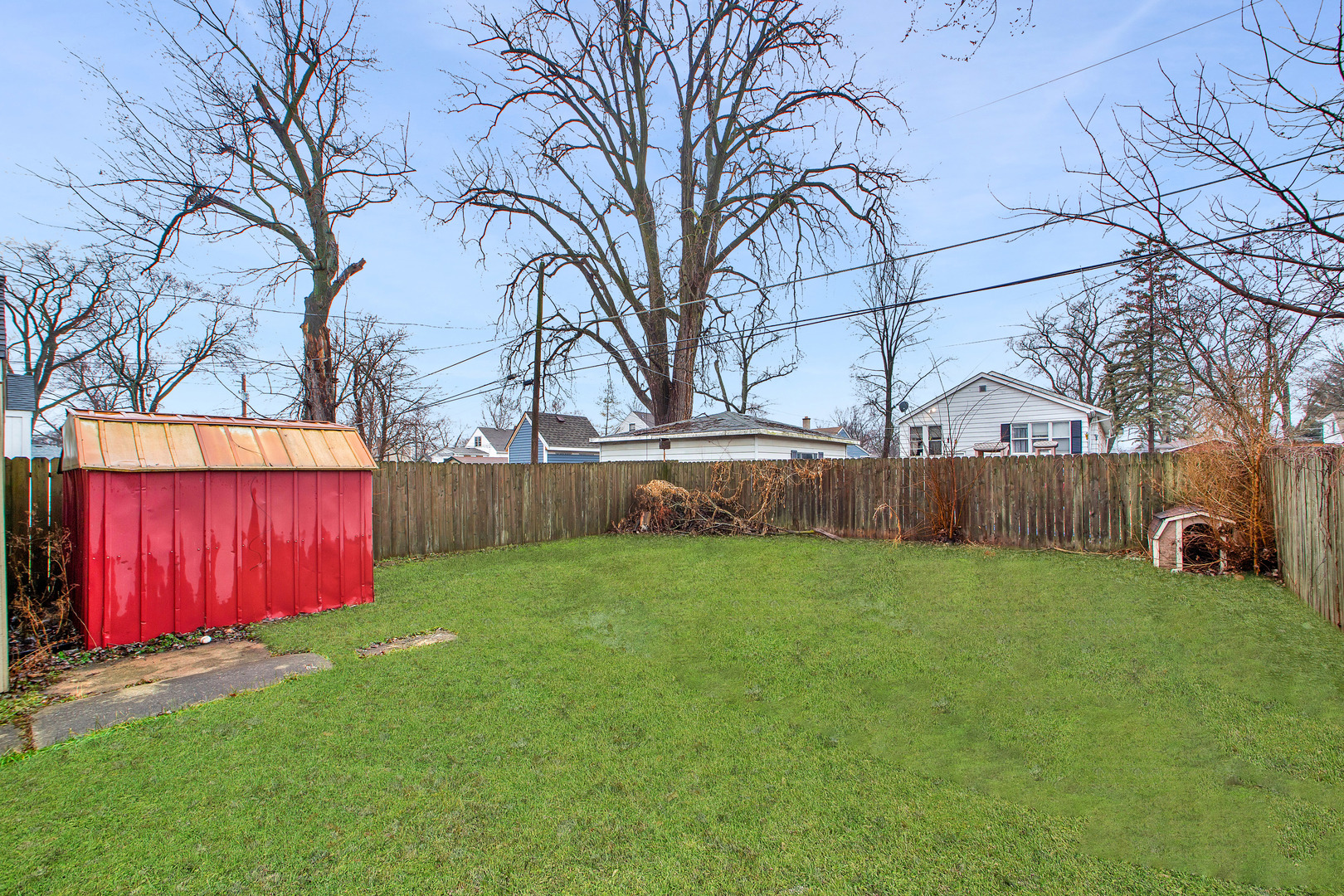 15014 Ridgeway Avenue Midlothian, IL 60445 - Photo 17 of 18 a view of backyard with tree and wooden fence