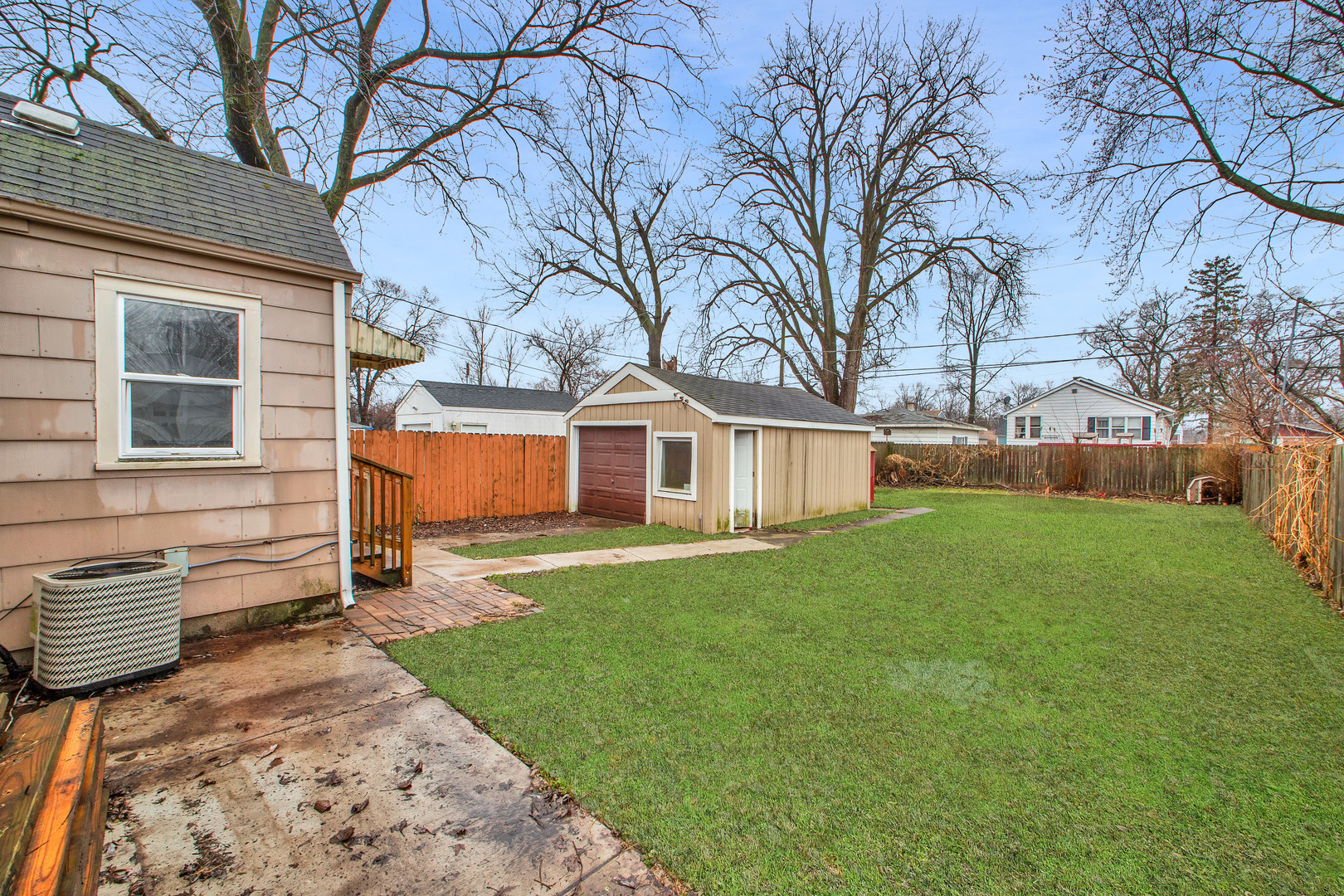 15014 Ridgeway Avenue Midlothian, IL 60445 - Photo 18 of 18 a view of a house with a yard