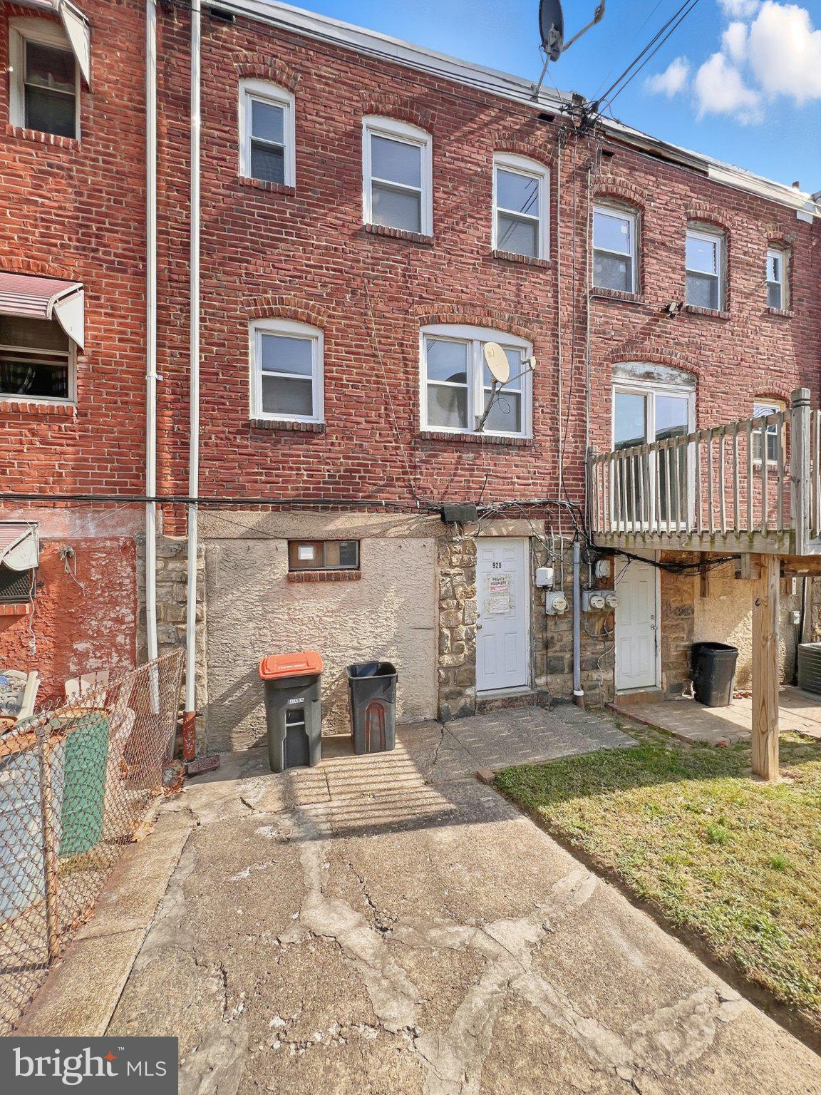 920 Butler Street Chester, PA 19013 - Photo 10 of 10 Charming brick facade with outdoor space.