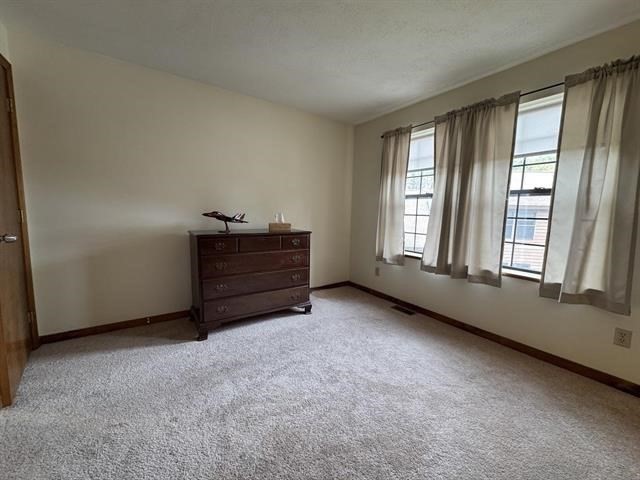 43 West Meadow Road, Unit 43 Haverhill, MA 01832 - Photo 26 of 42 an empty room with windows and cabinet