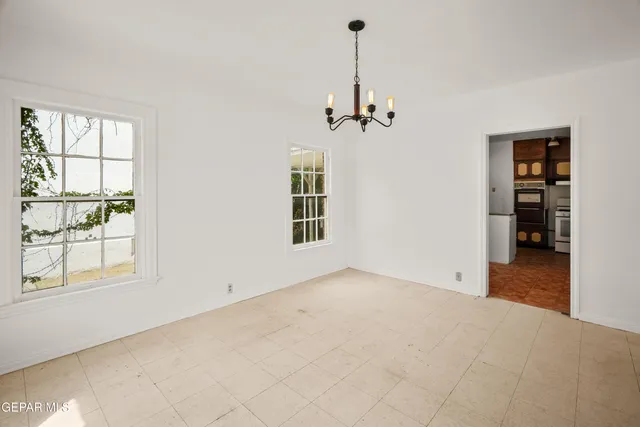 a spacious bathroom with a sink and a mirror