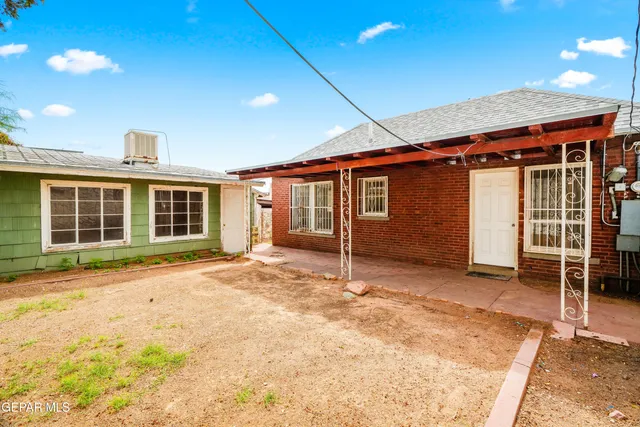 a house with trees in front of it