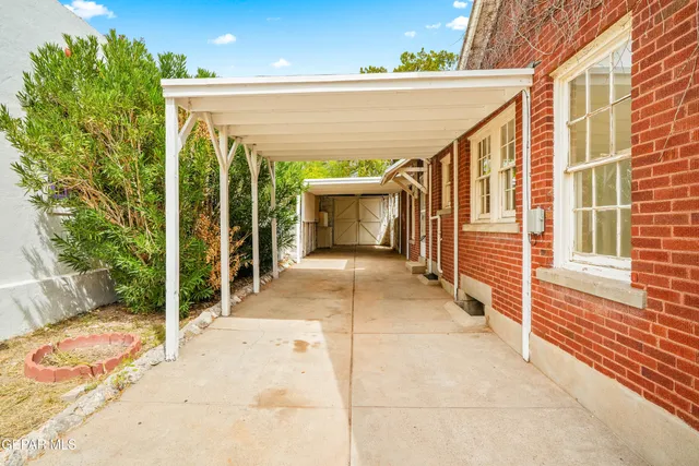 an aerial view of a house with a swimming pool