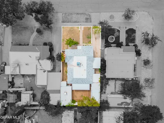 an aerial view of residential houses with outdoor space