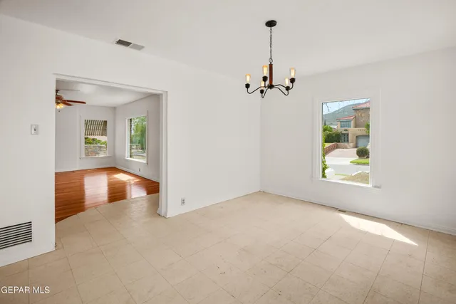 a view of empty room with windows