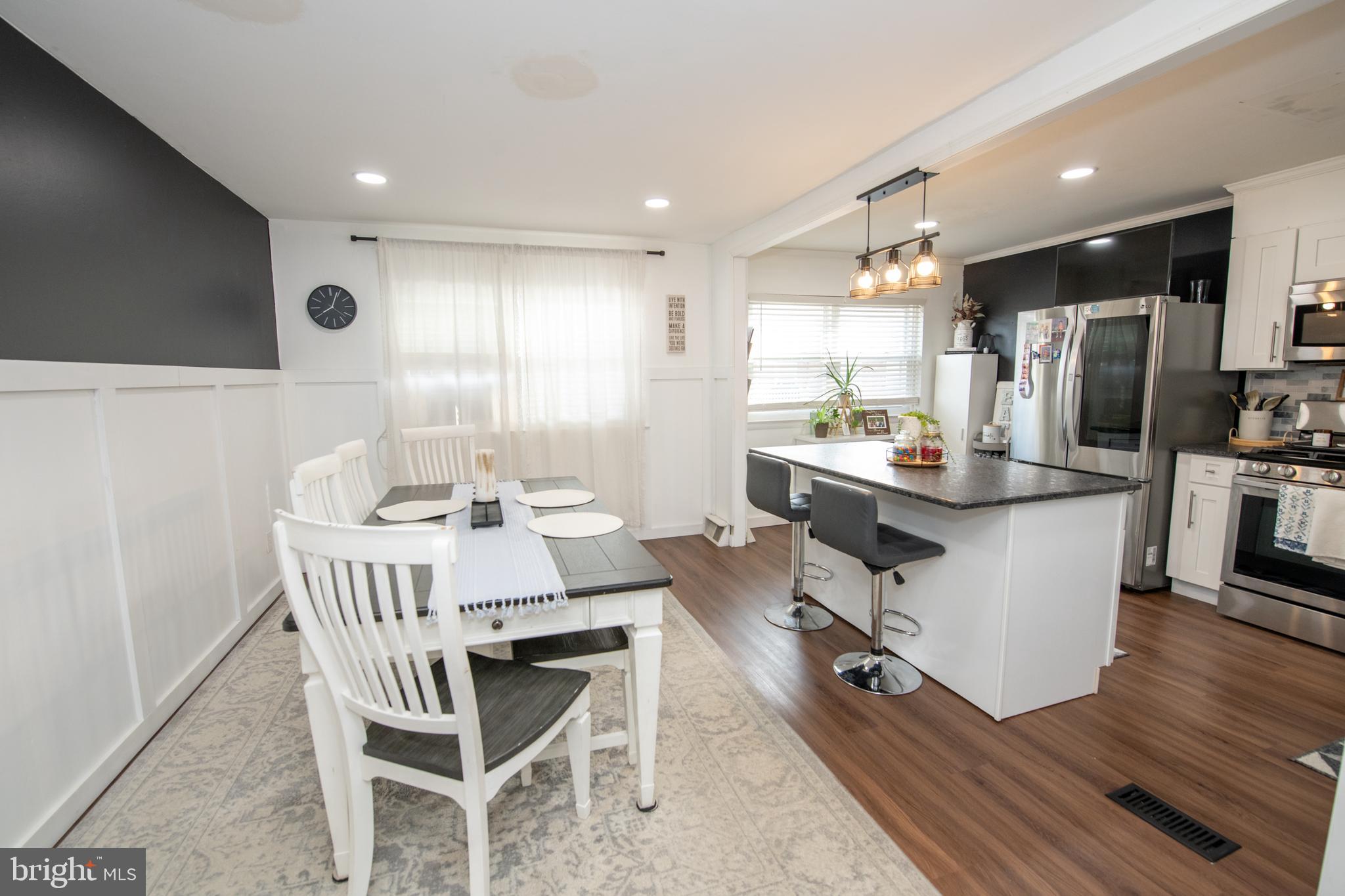 3141 Belgreen Road Philadelphia, PA 19154 - Photo 11 of 51 a view of a dining room with furniture a kitchen and chandelier