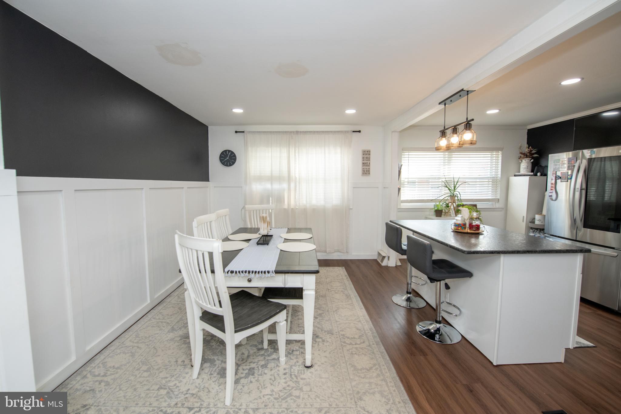 3141 Belgreen Road Philadelphia, PA 19154 - Photo 16 of 51 a kitchen with kitchen island a appliances dining table and chairs