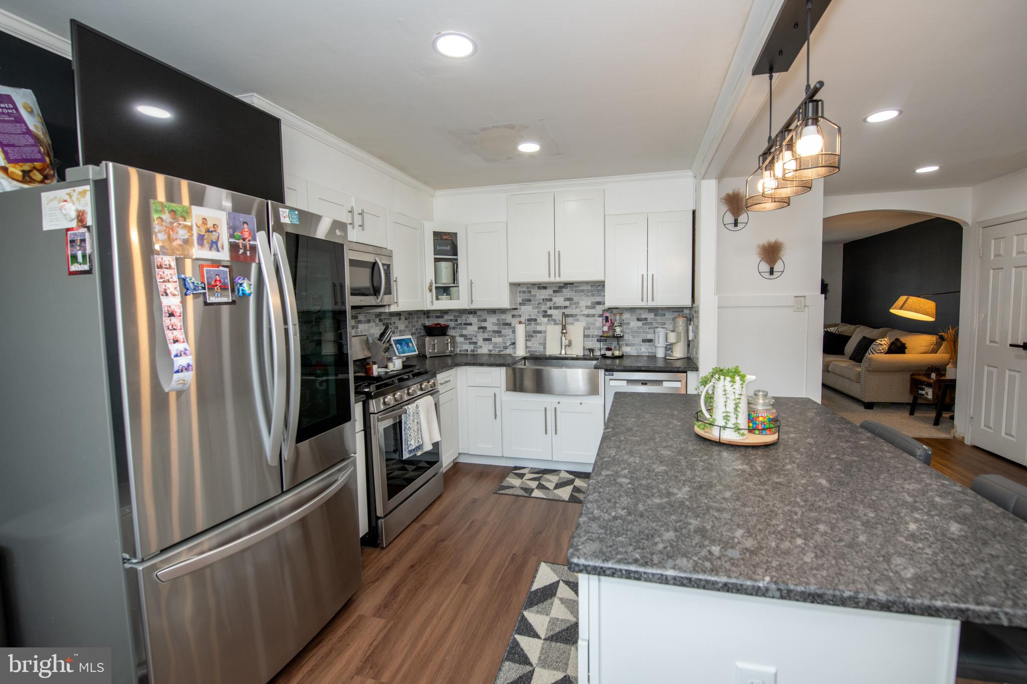 3141 Belgreen Road Philadelphia, PA 19154 - Photo 17 of 51 a kitchen with stainless steel appliances granite countertop a refrigerator and a sink