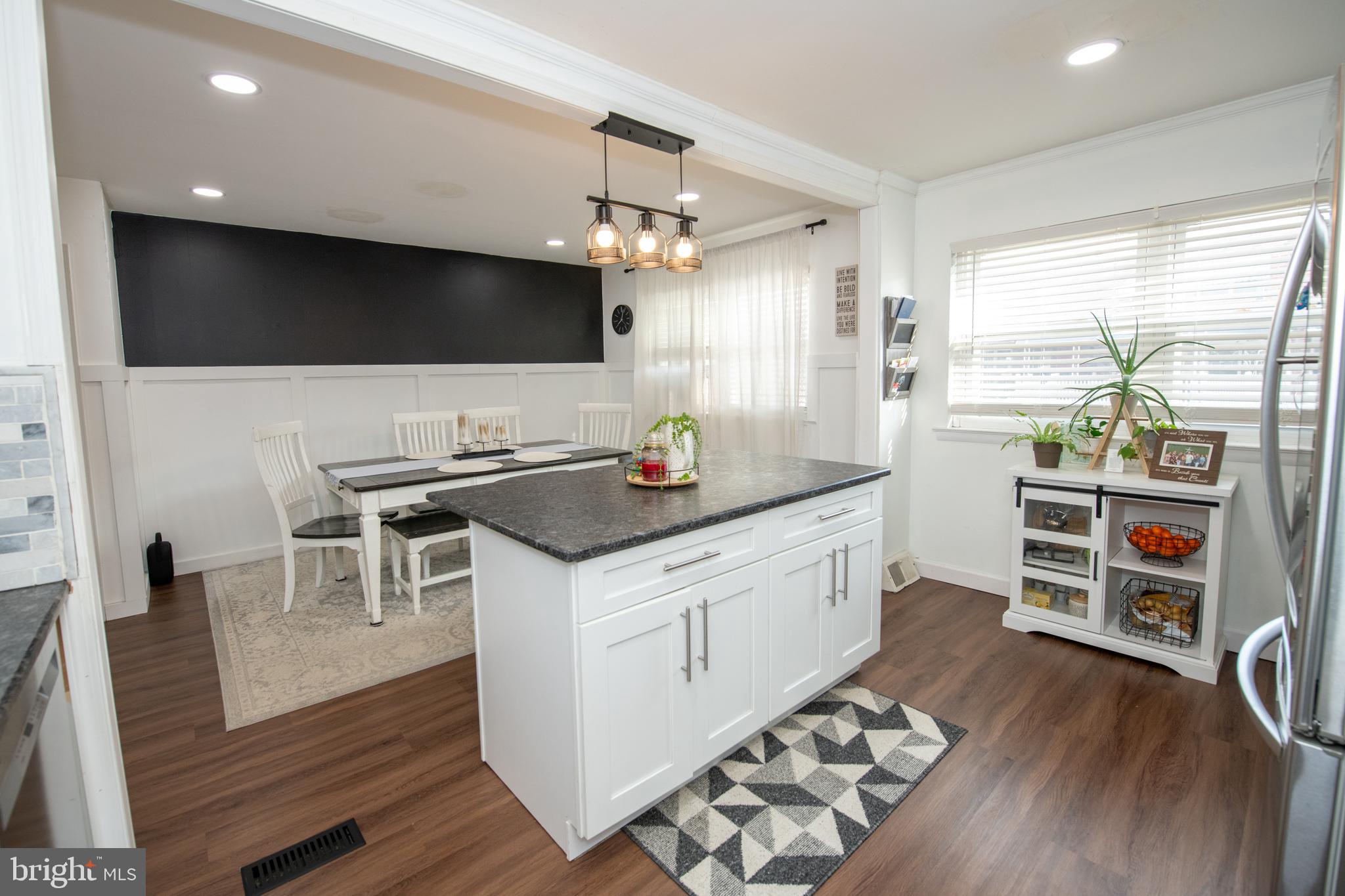 3141 Belgreen Road Philadelphia, PA 19154 - Photo 19 of 51 a kitchen with stainless steel appliances a kitchen island hardwood floor and a sink