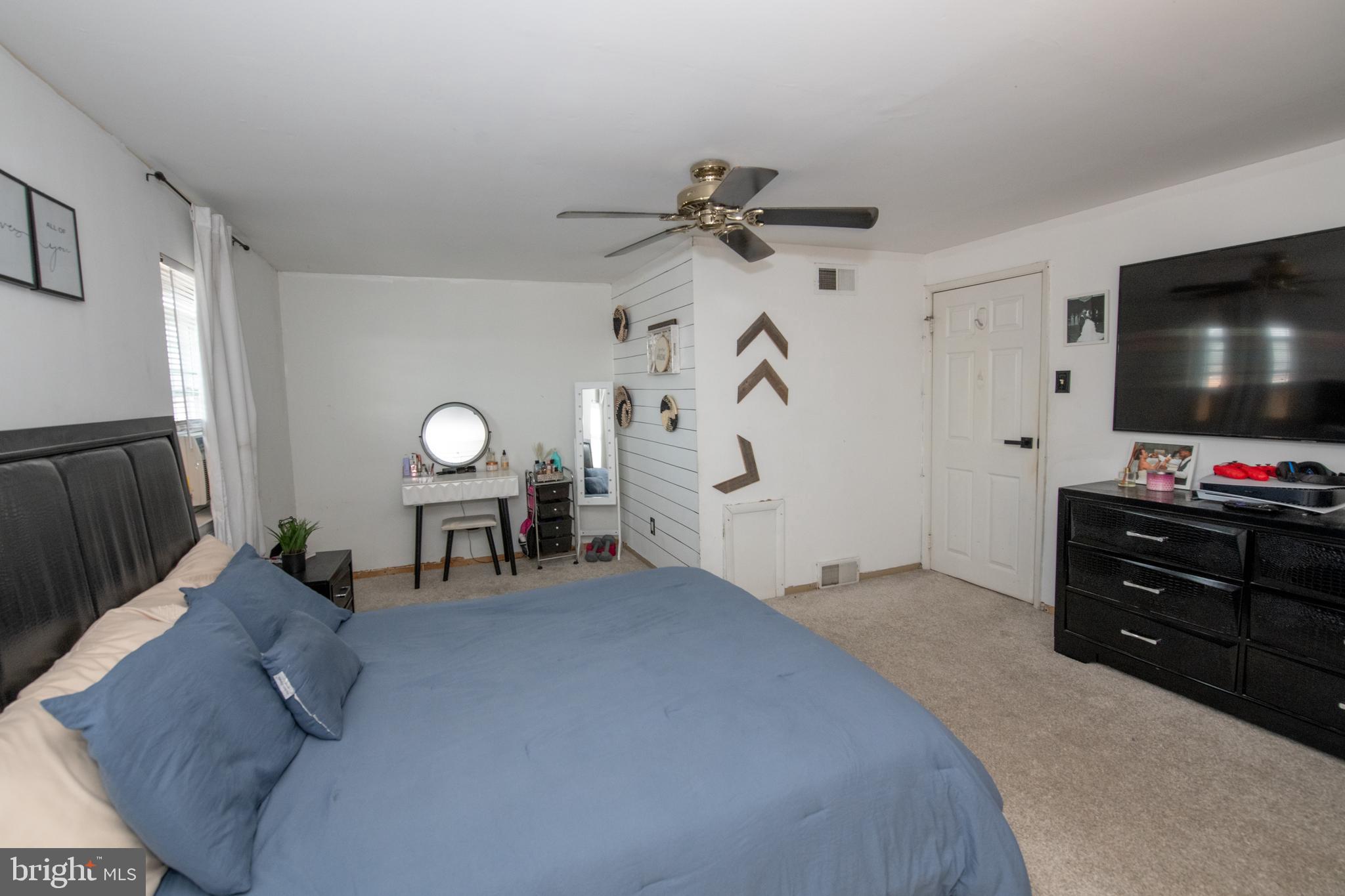 3141 Belgreen Road Philadelphia, PA 19154 - Photo 21 of 51 a bedroom with furniture and a flat screen tv