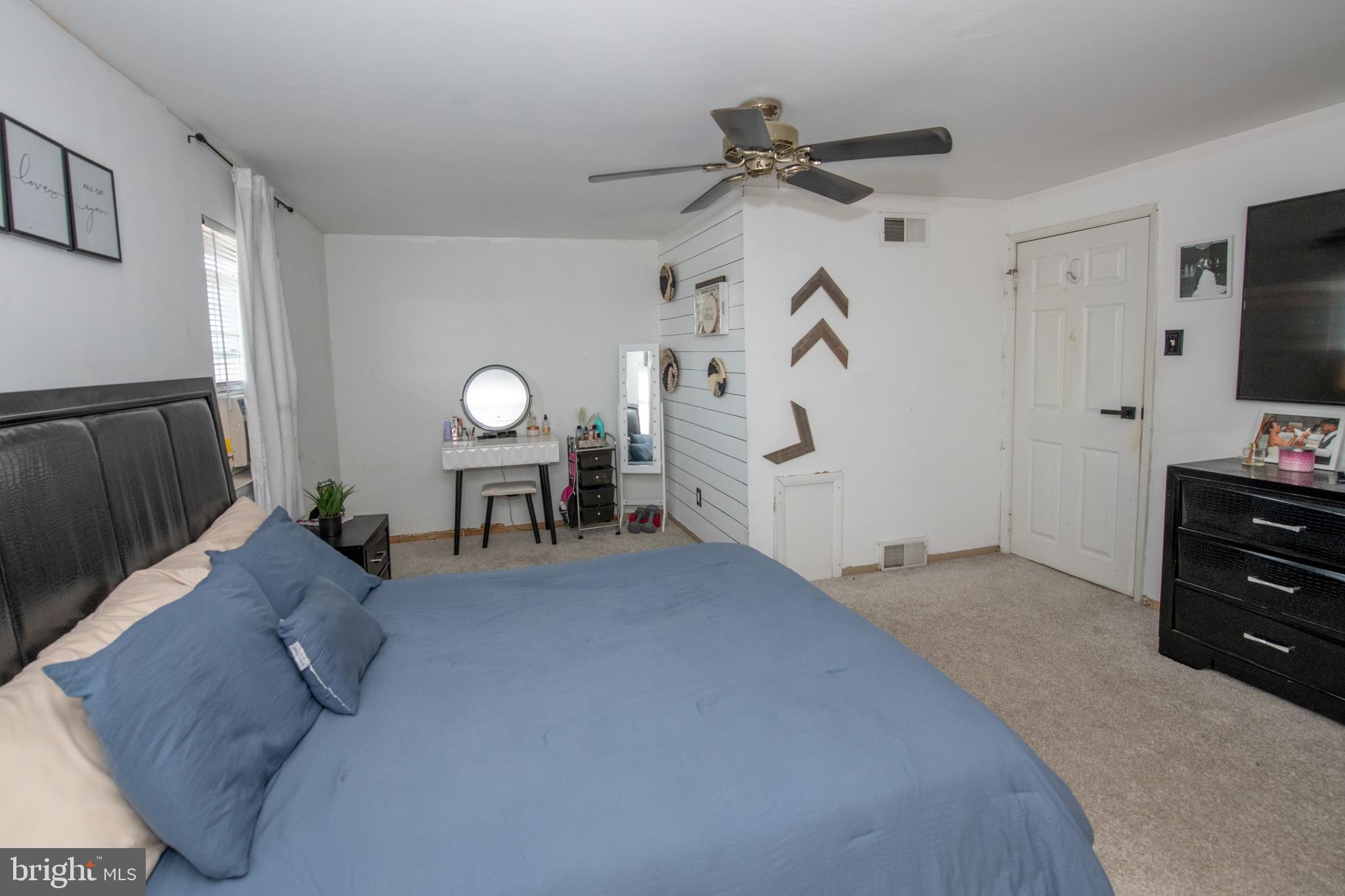 3141 Belgreen Road Philadelphia, PA 19154 - Photo 24 of 51 a living room with furniture and a flat screen tv