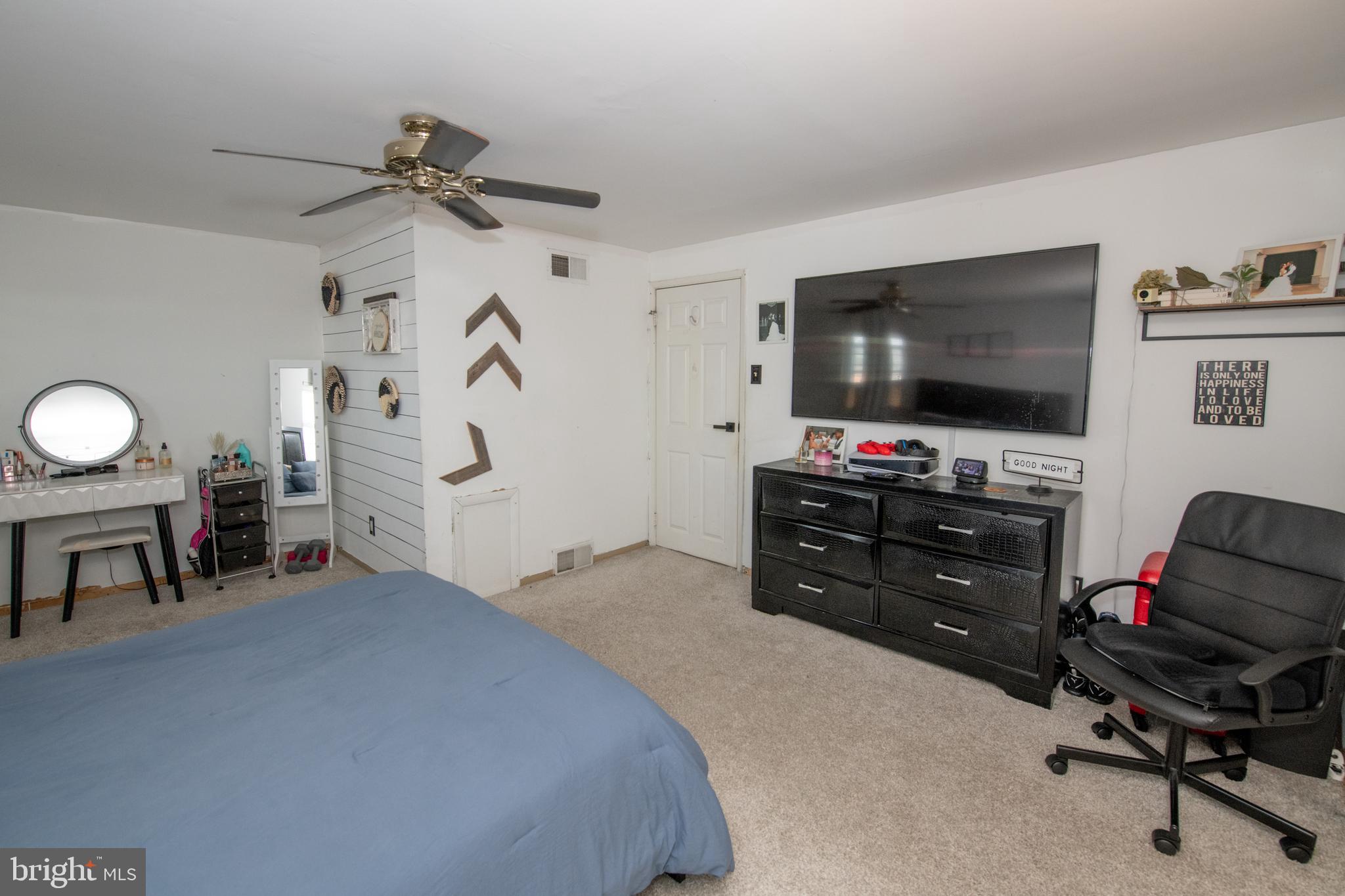 3141 Belgreen Road Philadelphia, PA 19154 - Photo 25 of 51 a bedroom with furniture and a flat screen tv