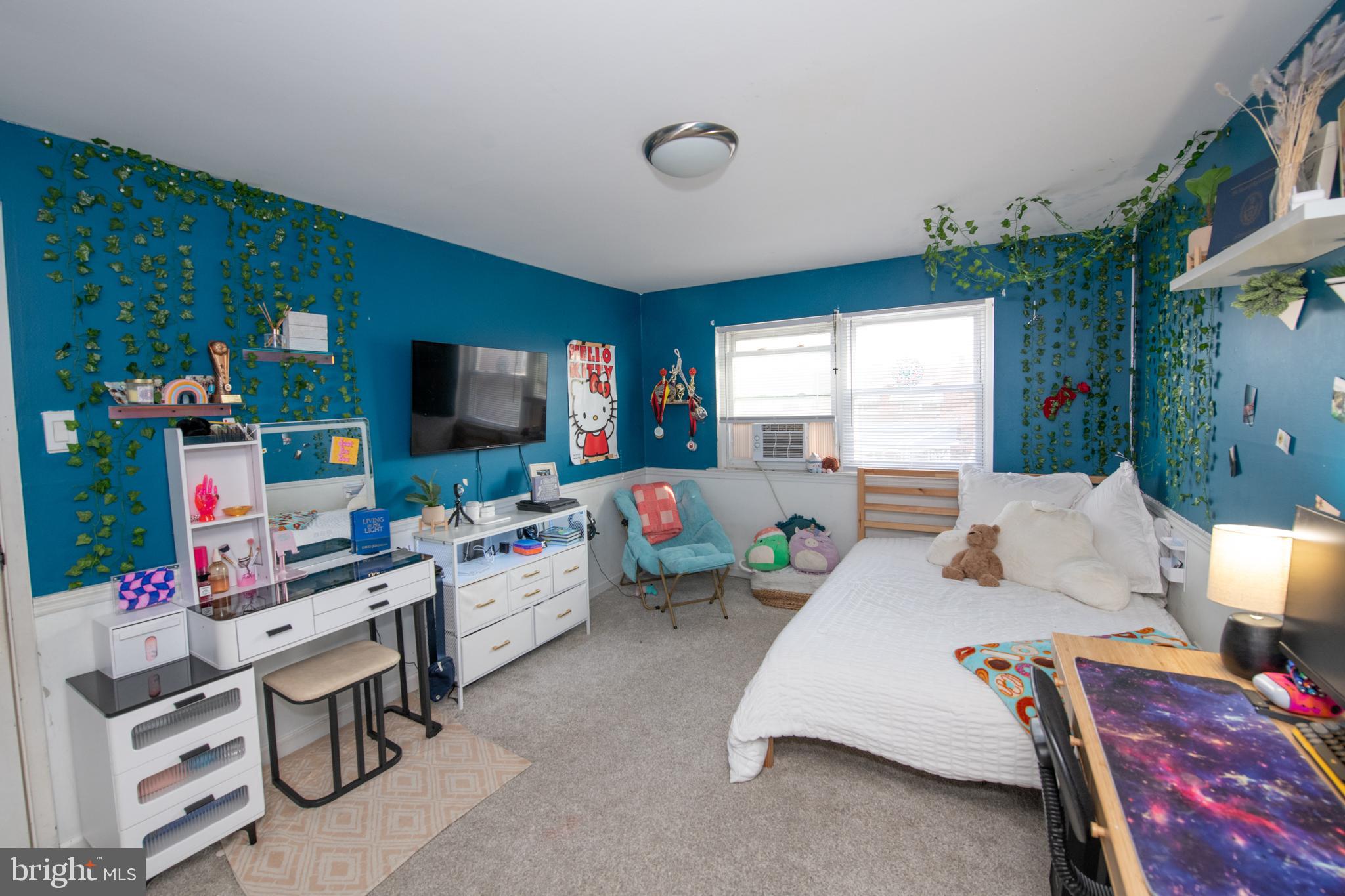 3141 Belgreen Road Philadelphia, PA 19154 - Photo 28 of 51 a bedroom with furniture a flat screen tv and a window