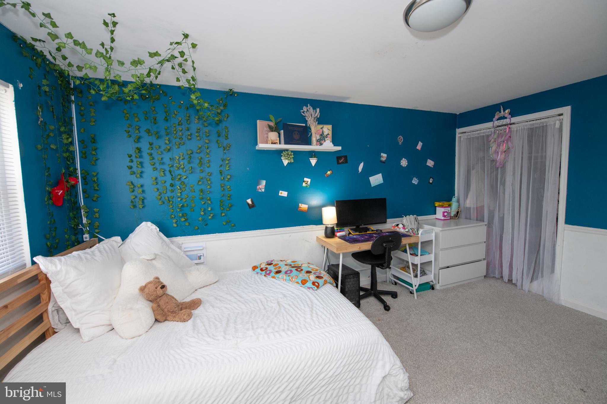 3141 Belgreen Road Philadelphia, PA 19154 - Photo 29 of 51 a bedroom that has a bed and a desk in it