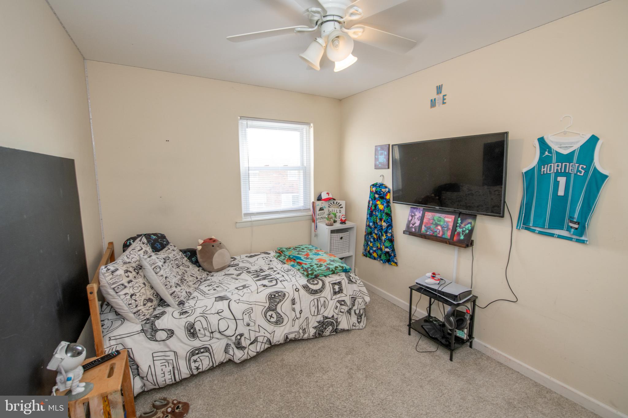 3141 Belgreen Road Philadelphia, PA 19154 - Photo 34 of 51 a bedroom with furniture and a flat screen tv