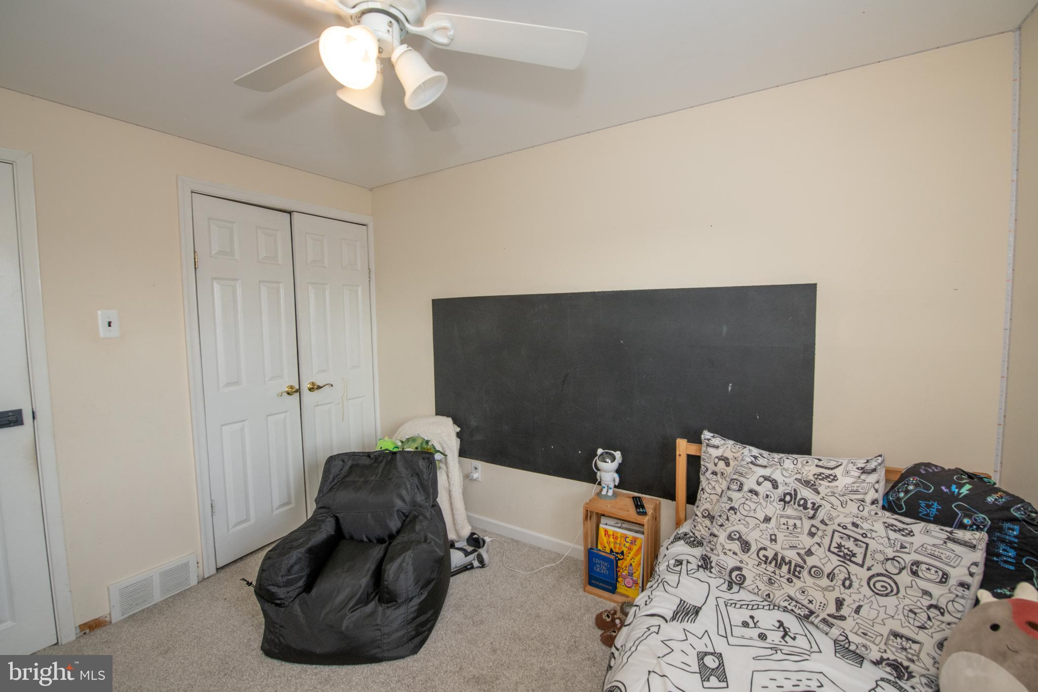 3141 Belgreen Road Philadelphia, PA 19154 - Photo 36 of 51 a bedroom with a bed and a chandelier