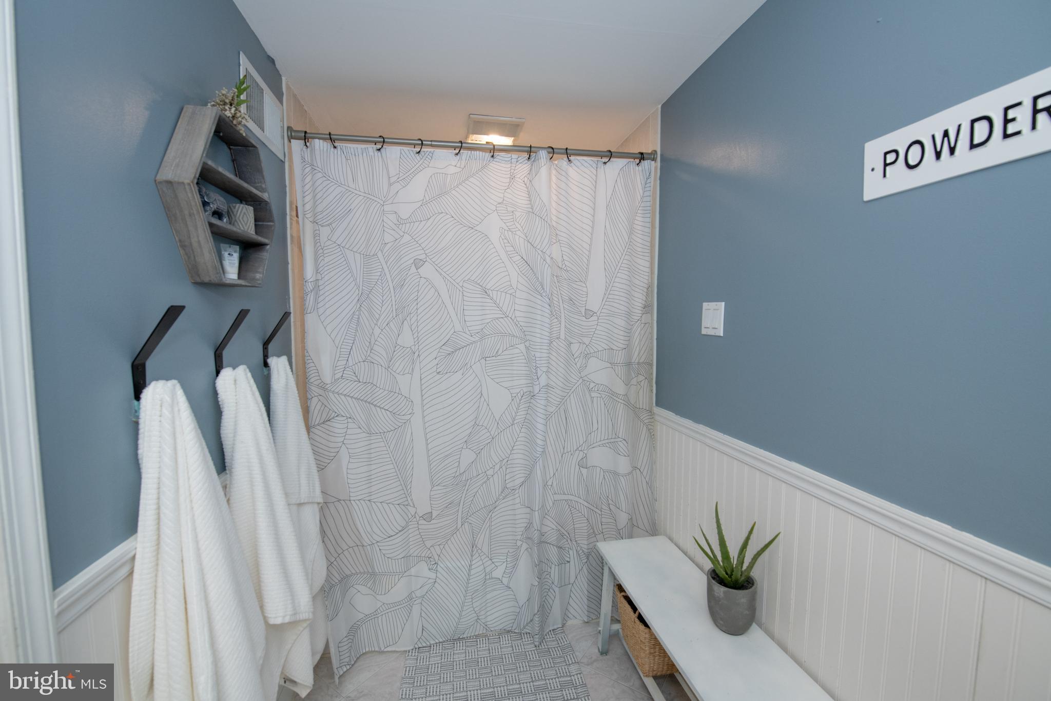 3141 Belgreen Road Philadelphia, PA 19154 - Photo 37 of 51 a bathroom with a shower curtain and a potted plant