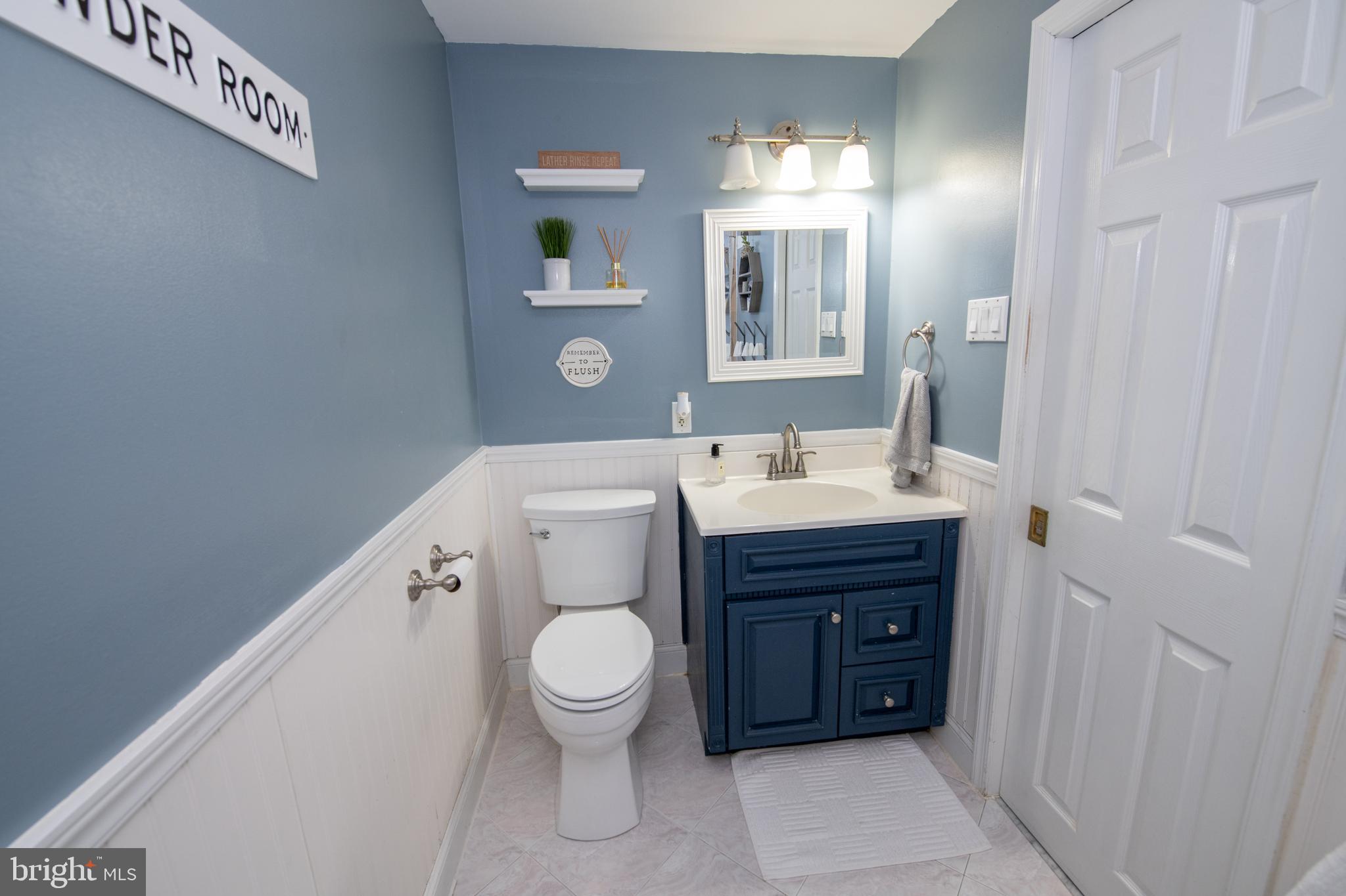 3141 Belgreen Road Philadelphia, PA 19154 - Photo 38 of 51 a bathroom with a toilet sink and mirror