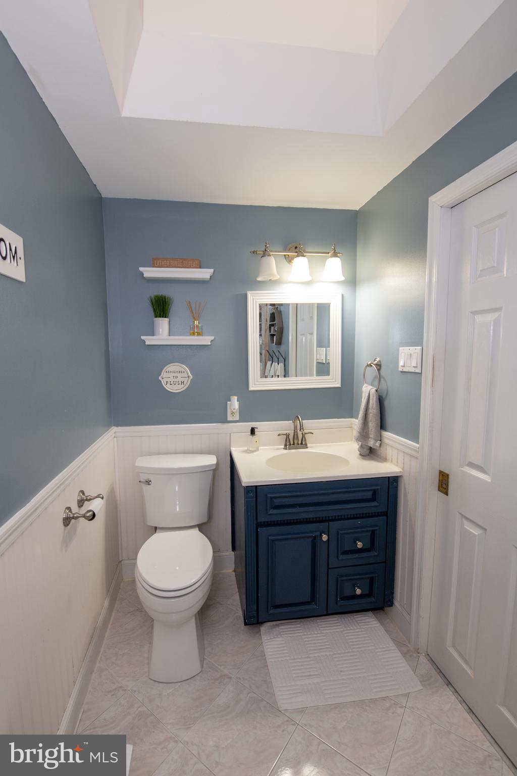 3141 Belgreen Road Philadelphia, PA 19154 - Photo 39 of 51 a spacious bathroom with a toilet a sink and mirror