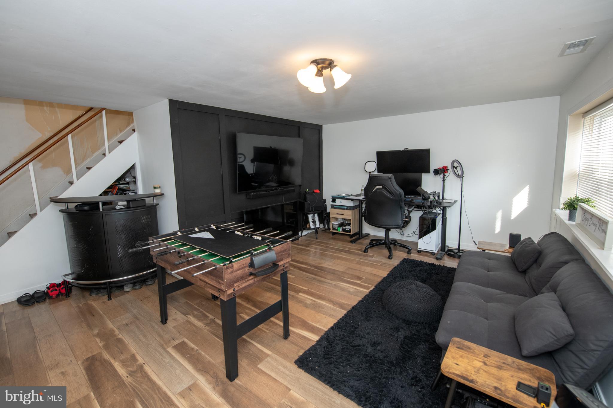 3141 Belgreen Road Philadelphia, PA 19154 - Photo 40 of 51 a living room with furniture and a flat screen tv