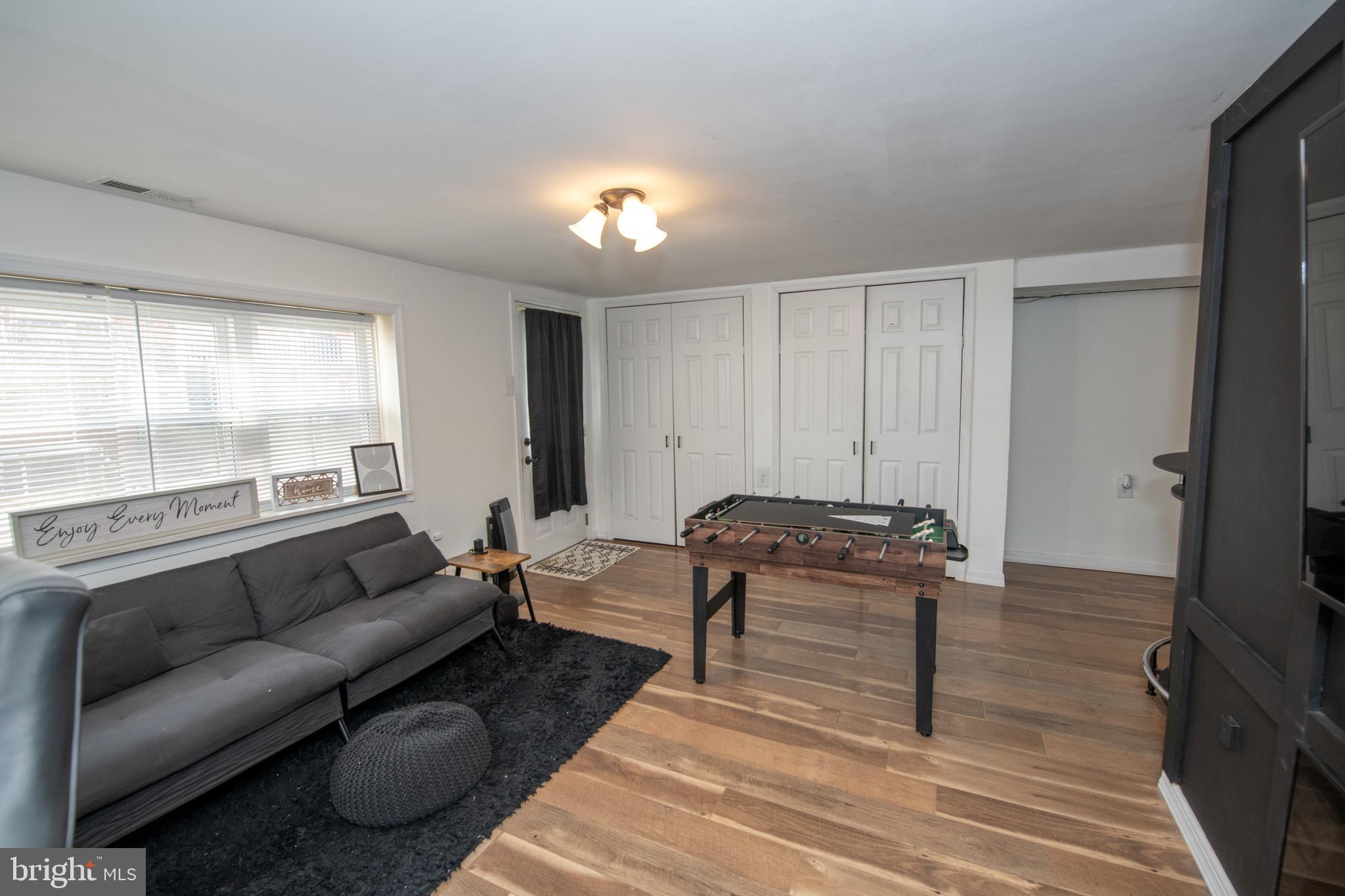 3141 Belgreen Road Philadelphia, PA 19154 - Photo 41 of 51 a living room with furniture and a flat screen tv