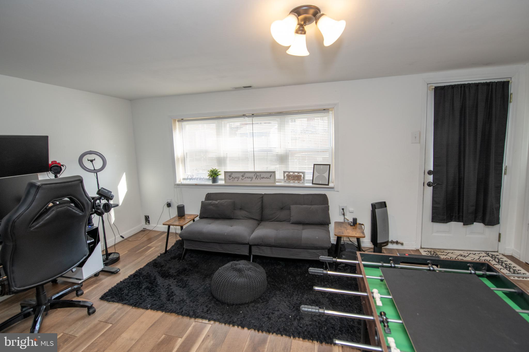 3141 Belgreen Road Philadelphia, PA 19154 - Photo 43 of 51 a living room with furniture and a flat screen tv