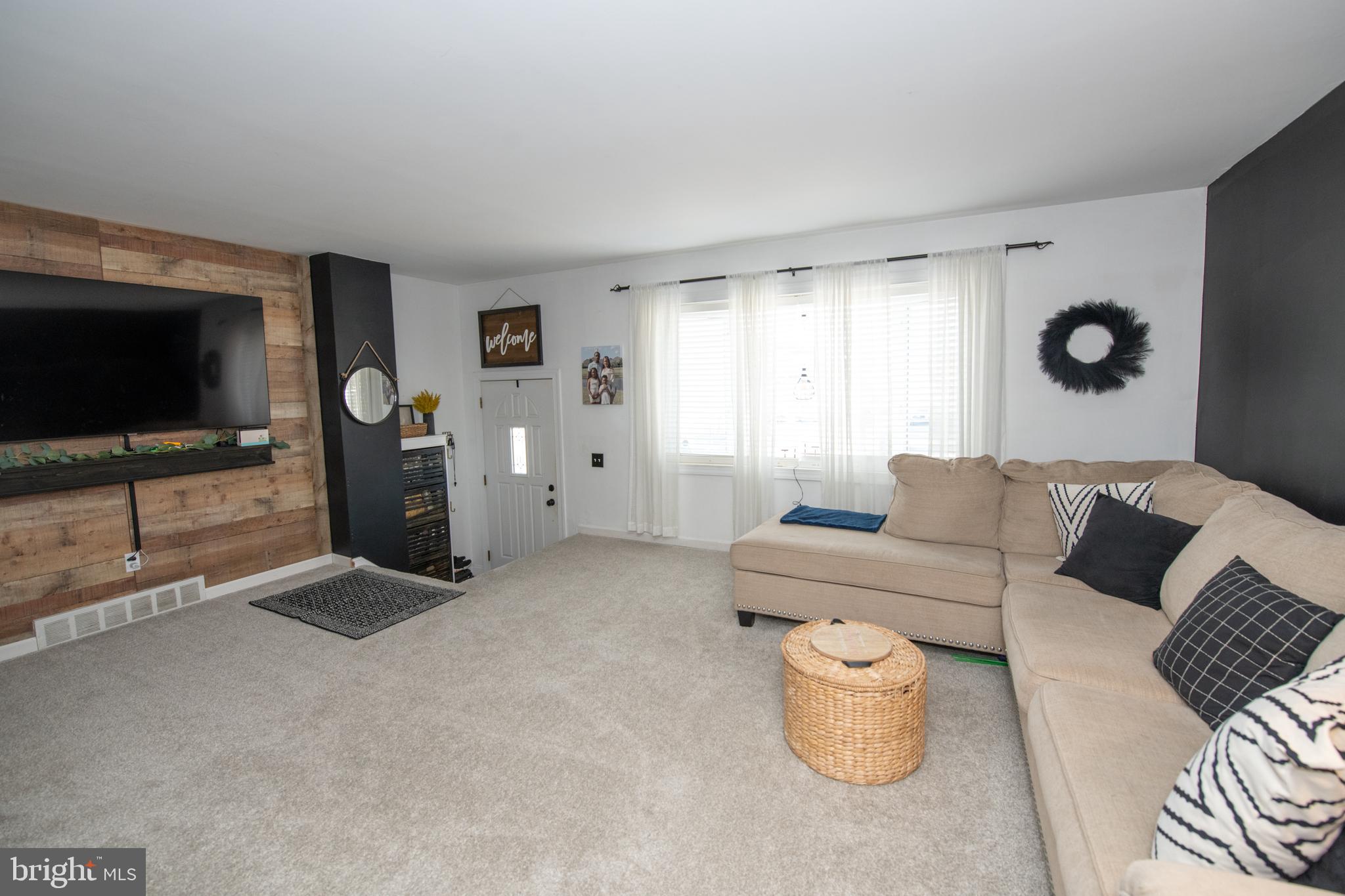 3141 Belgreen Road Philadelphia, PA 19154 - Photo 5 of 51 a living room with furniture and a flat screen tv