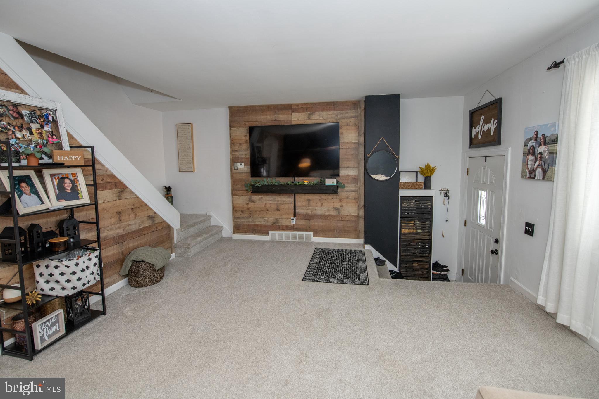 3141 Belgreen Road Philadelphia, PA 19154 - Photo 6 of 51 a living room with furniture and a flat screen tv