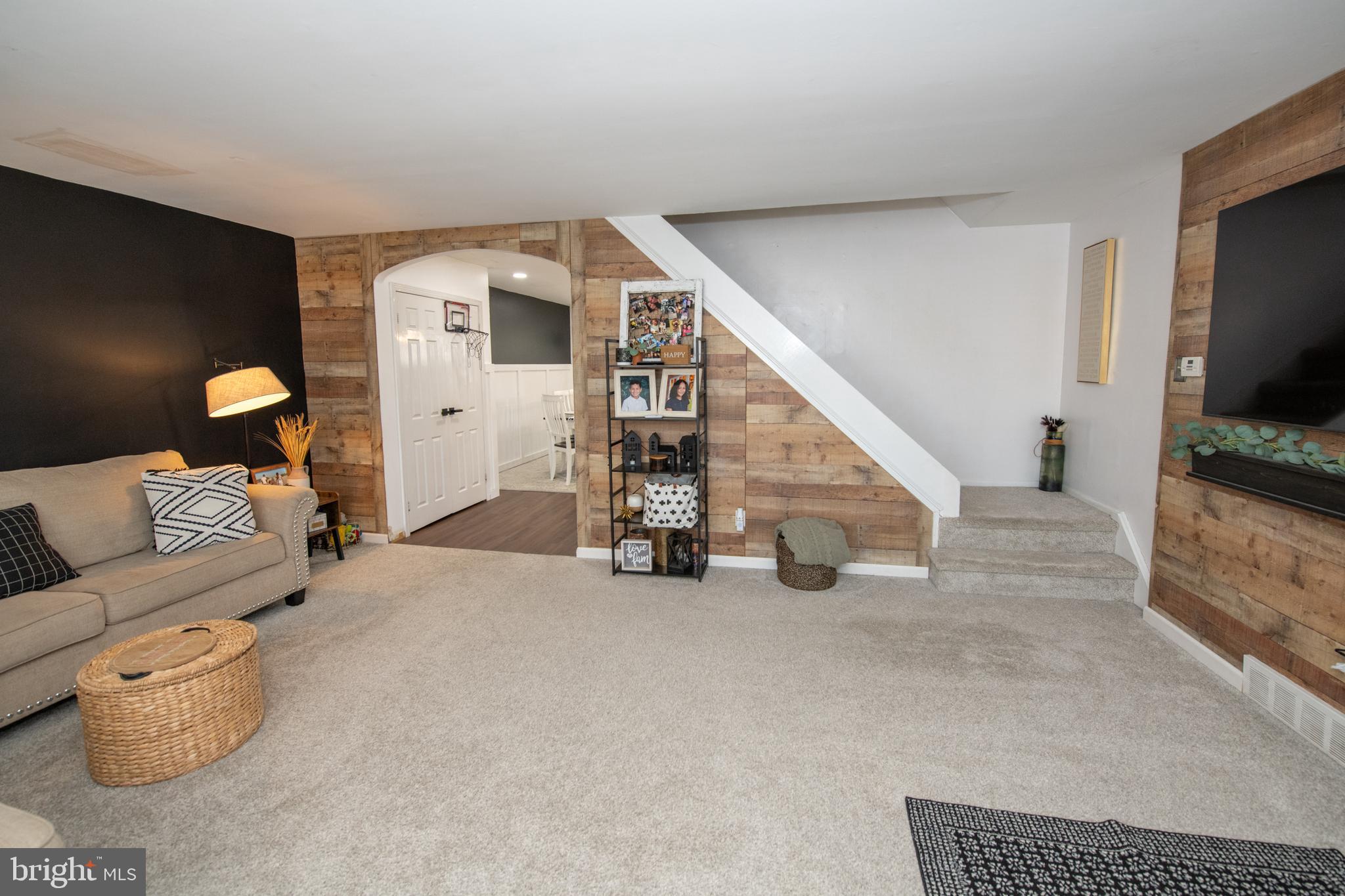 3141 Belgreen Road Philadelphia, PA 19154 - Photo 7 of 51 a living room with furniture and a flat screen tv