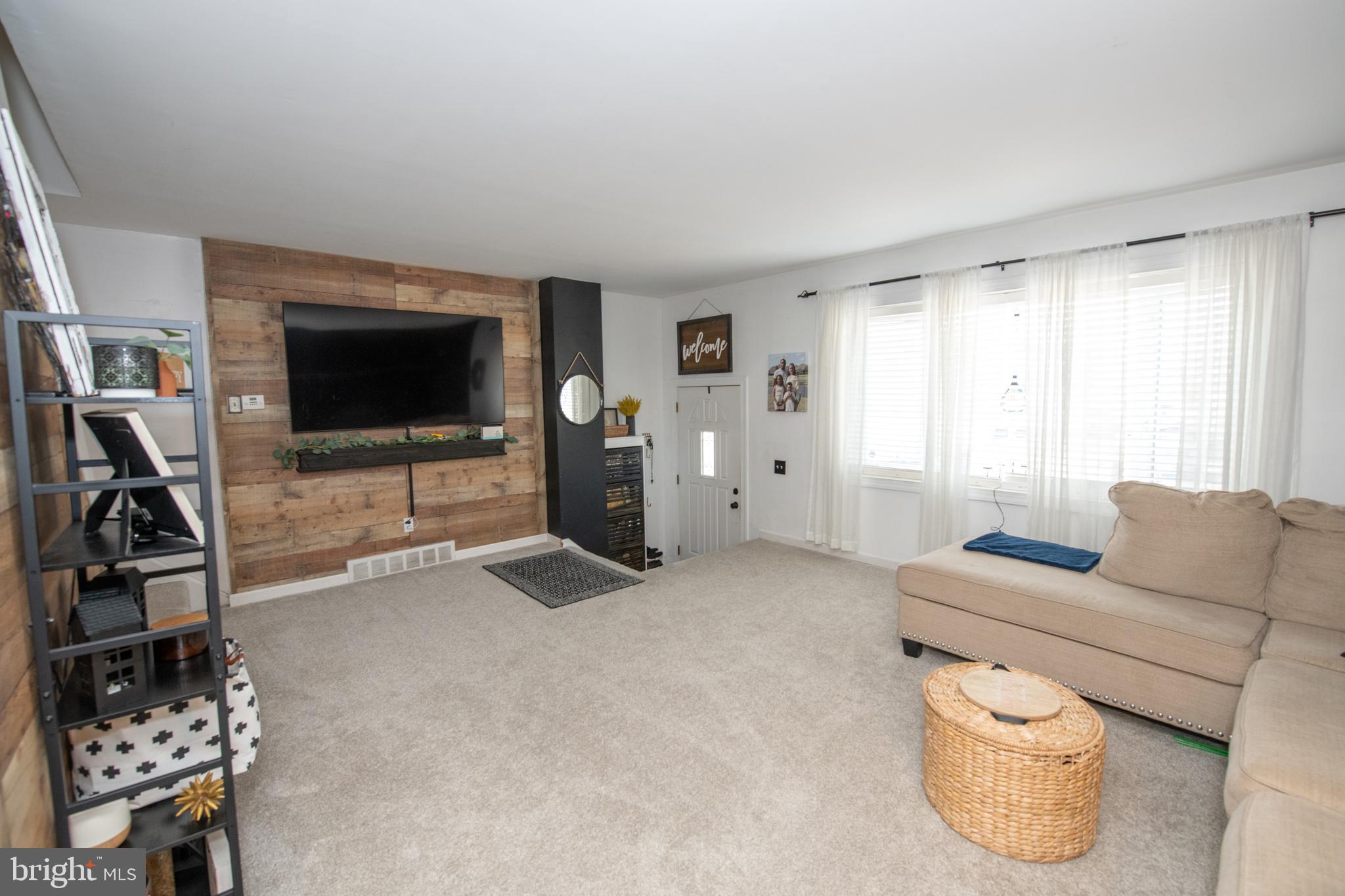 3141 Belgreen Road Philadelphia, PA 19154 - Photo 10 of 51 a living room with furniture and a flat screen tv