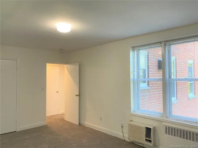 a view of an empty room and window