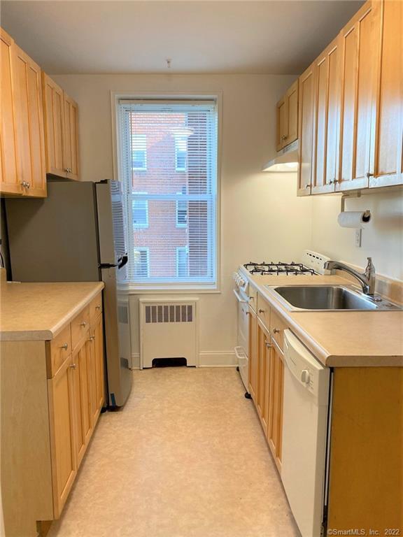 46 Prospect Avenue, Unit 3D Norwalk, CT 06850 - Photo 8 of 20 a kitchen with stainless steel appliances a stove a refrigerator a sink a oven and cabinets