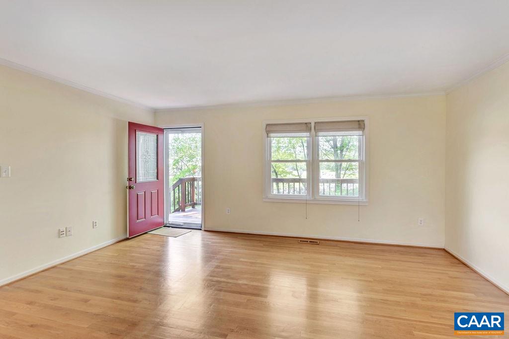 229 Stephens Loop Ruckersville, VA 22968 - Photo 6 of 29 an empty room with wooden floor and windows