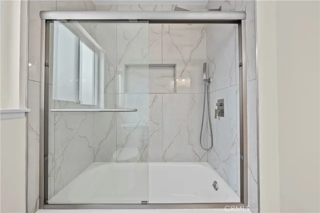 a bathroom with a toilet a sink and a mirror