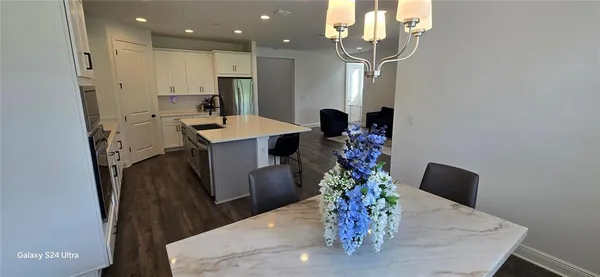 a very nice looking dining room with a table and chairs