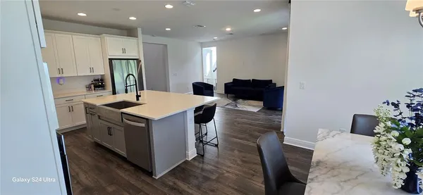 a kitchen with a sink and refrigerator
