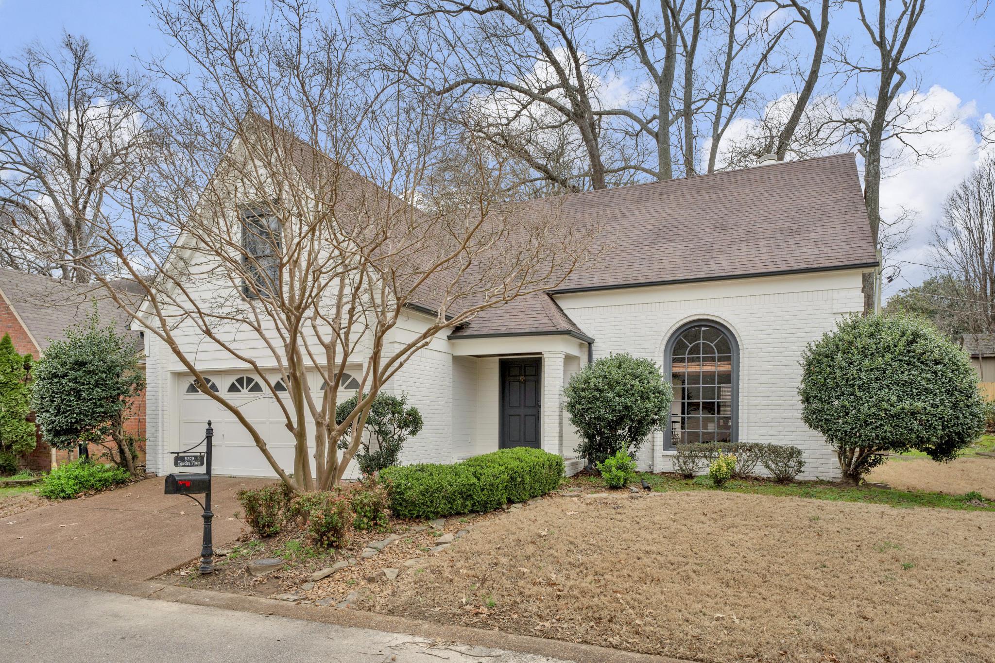5379 Bentley Place Memphis, TN 38120 - Photo 1 of 25 a front view of a house with garden