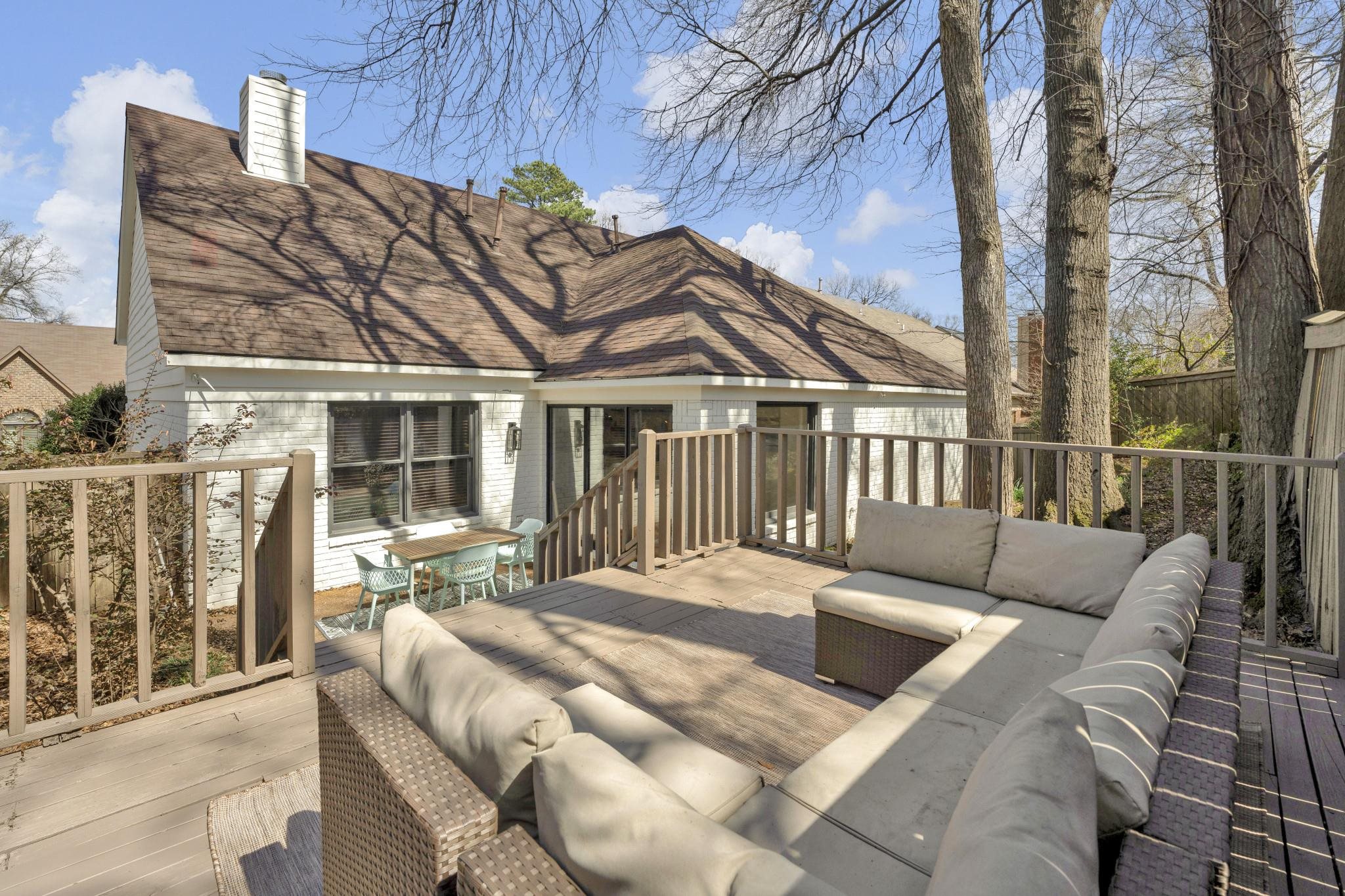 5379 Bentley Place Memphis, TN 38120 - Photo 24 of 25 a view of a patio with couches table and chairs and wooden floor