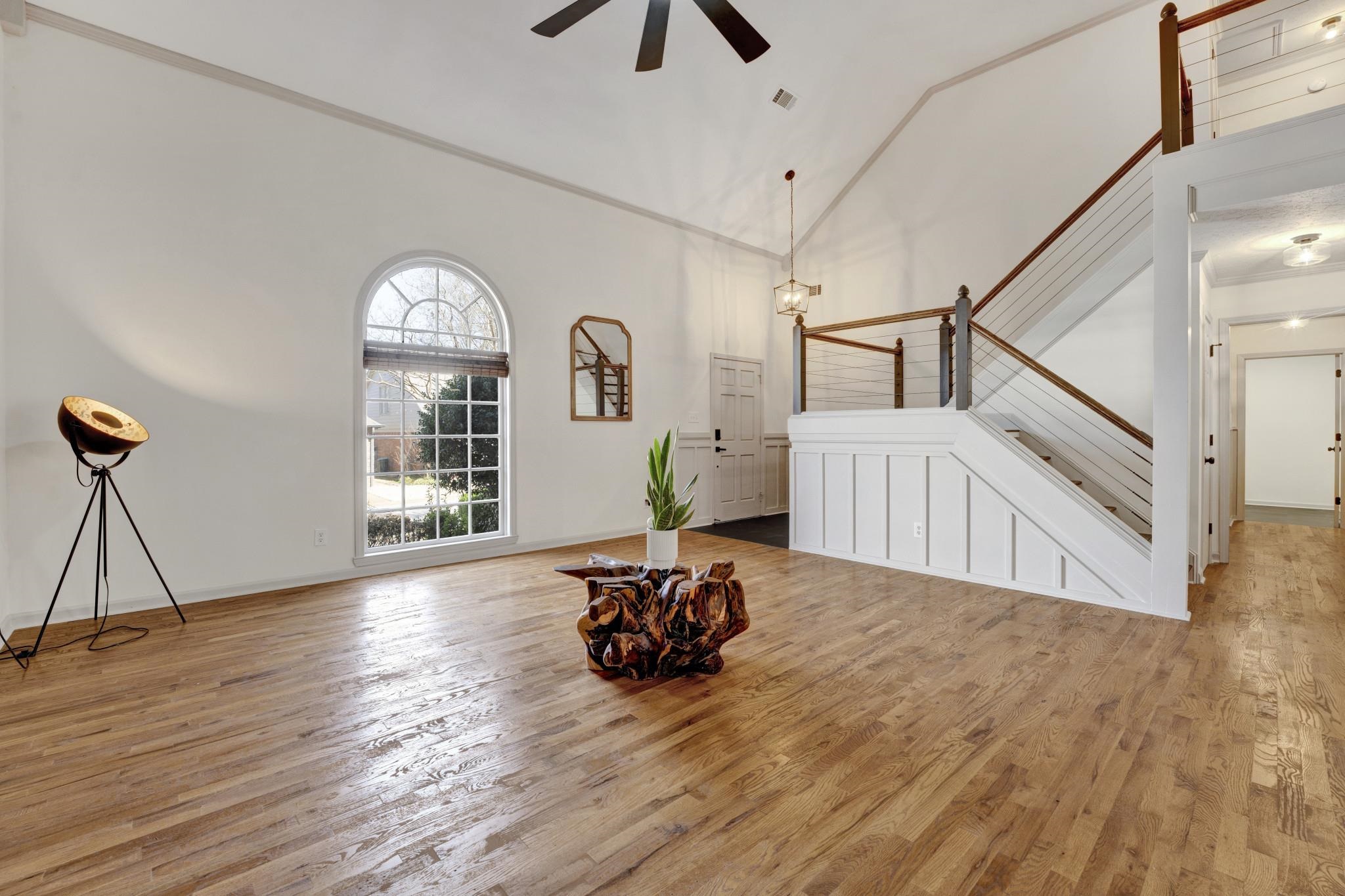 5379 Bentley Place Memphis, TN 38120 - Photo 5 of 25 a view of a livingroom with furniture hardwood floor and a ceiling fan