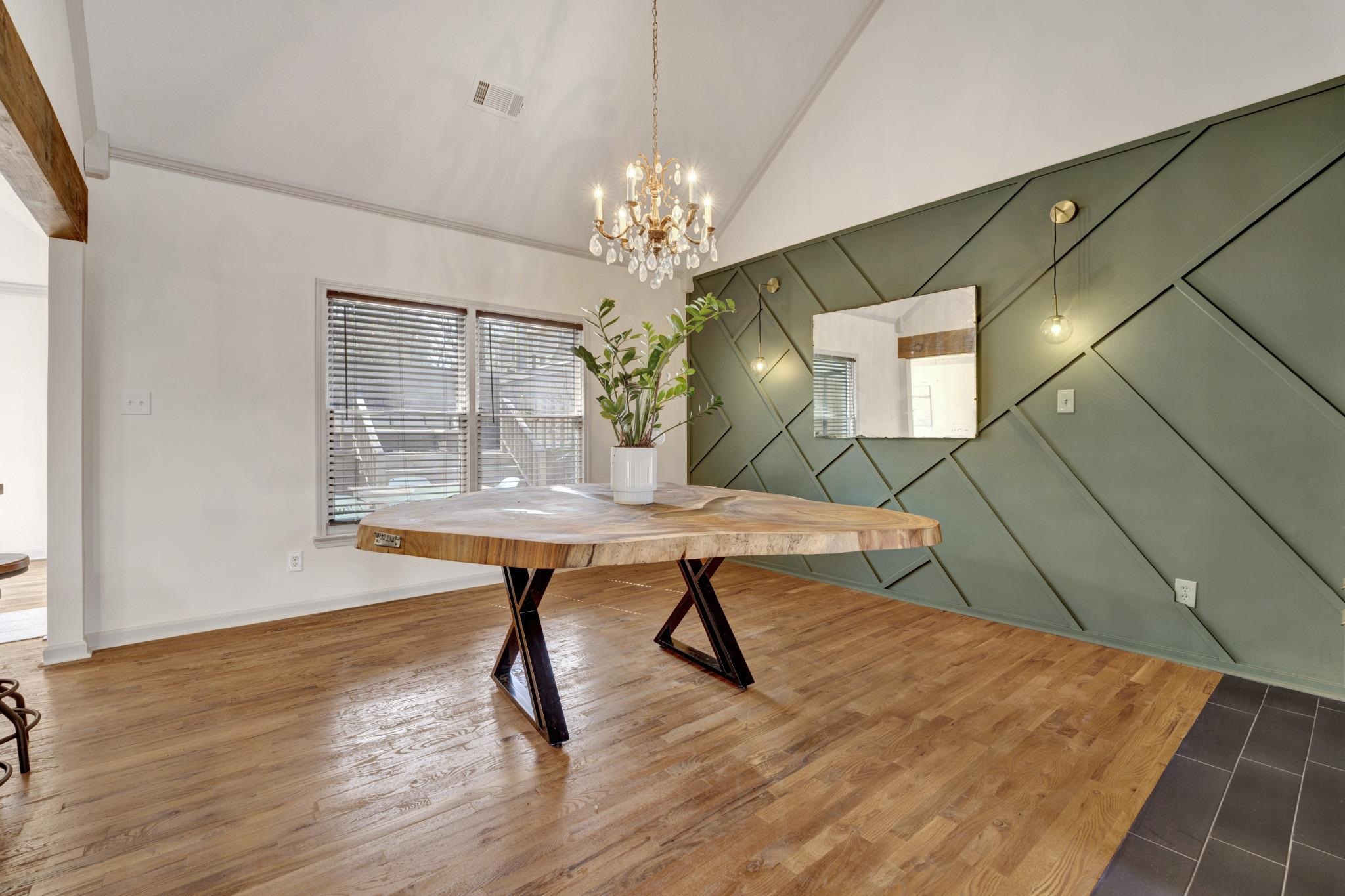 5379 Bentley Place Memphis, TN 38120 - Photo 8 of 25 a room with table chairs wooden floor and a chandelier