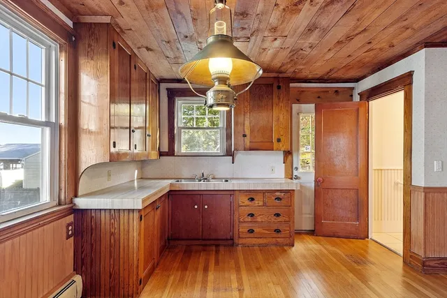 a very nice looking kitchen with a large window