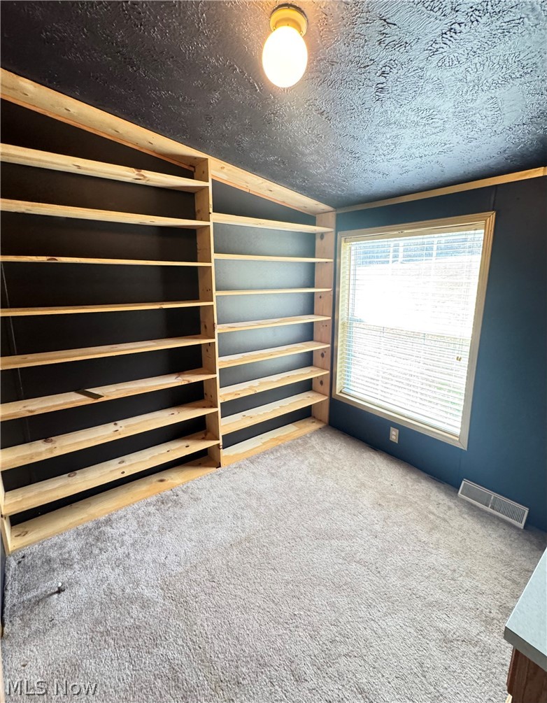 28240 Osborne Road Coolville, OH 45723 - Photo 15 of 29 Carpeted spare room with a textured ceiling