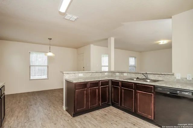 a kitchen with a sink and a window