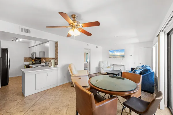 a kitchen with stainless steel appliances kitchen island granite countertop a sink and cabinets